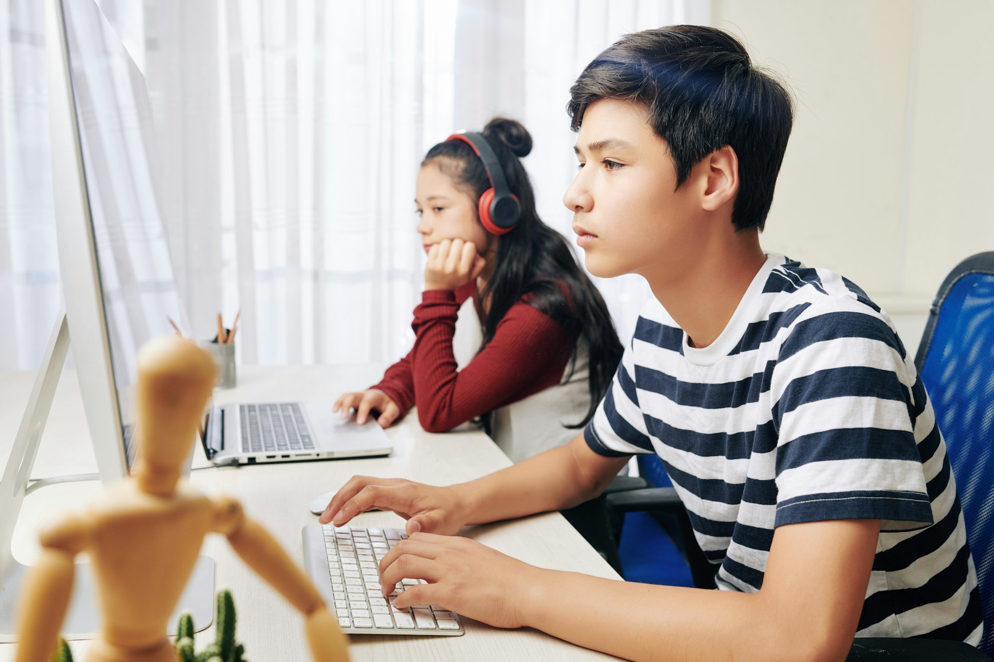 Teenagers working on computers